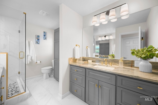 bathroom with marble finish floor, a marble finish shower, visible vents, vanity, and baseboards