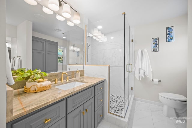 bathroom with marble finish floor, a marble finish shower, visible vents, vanity, and baseboards