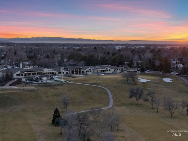 aerial view at dusk featuring a residential view