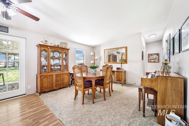 dining area with a healthy amount of sunlight, ceiling fan, and light wood-type flooring