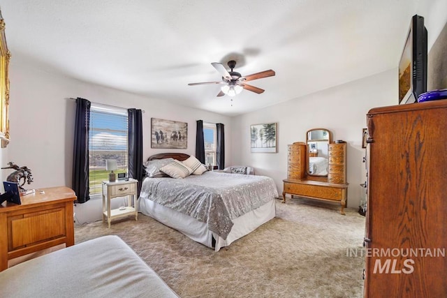 carpeted bedroom with ceiling fan