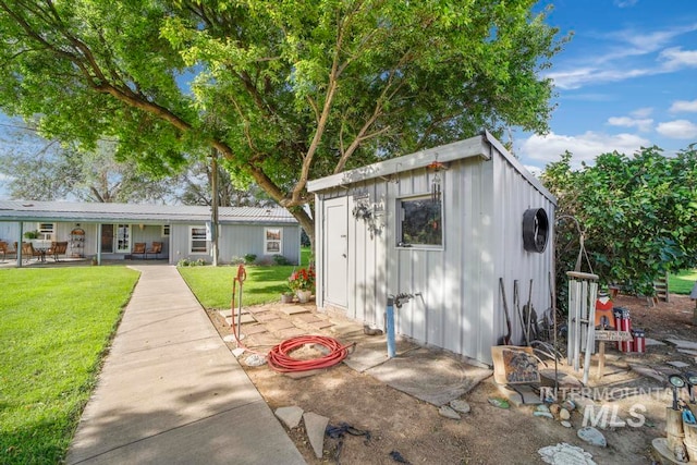 view of shed / structure with a lawn