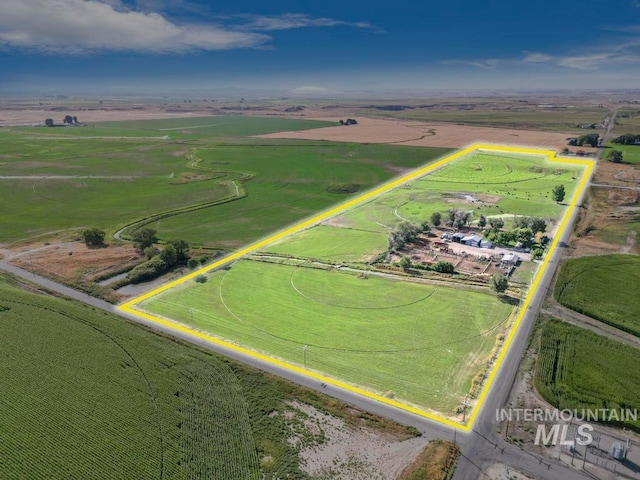 birds eye view of property featuring a rural view