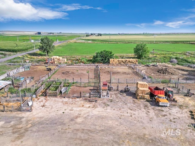 birds eye view of property featuring a rural view