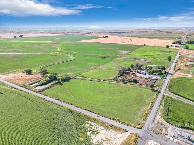 birds eye view of property featuring a rural view