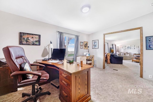 office featuring light colored carpet and lofted ceiling