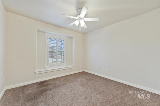 empty room featuring carpet flooring, ceiling fan, and baseboards