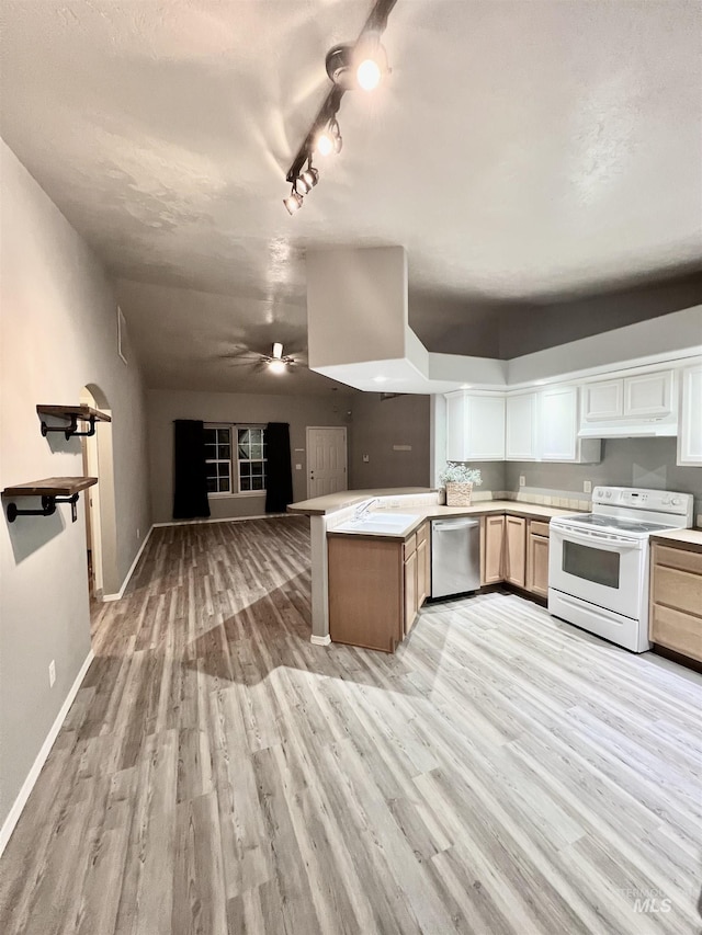 981 SW Independence, Mountain Home, ID 83647 - kitchen with white electric range, dishwasher, a sink, open floor plan, and light wood-style floors