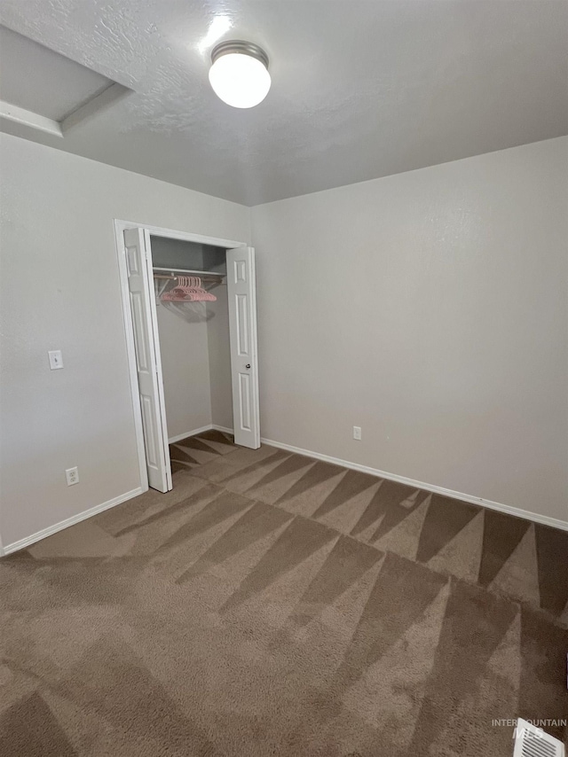 981 SW Independence, Mountain Home, ID 83647 - unfurnished bedroom with a closet, carpet, baseboards, and visible vents