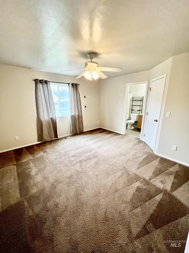 981 SW Independence, Mountain Home, ID 83647 - unfurnished bedroom featuring ensuite bath, baseboards, and carpet floors