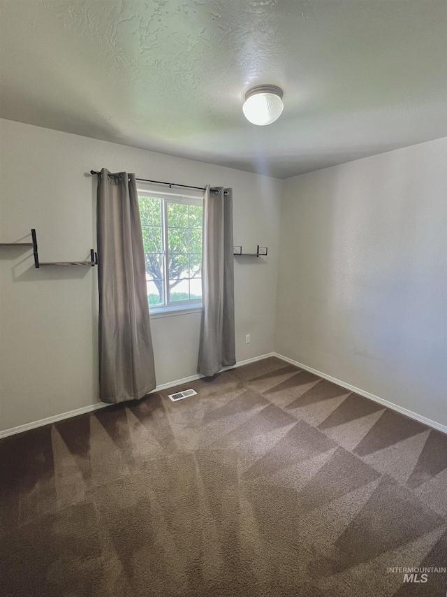 981 SW Independence, Mountain Home, ID 83647 - spare room with a textured ceiling, baseboards, visible vents, and carpet