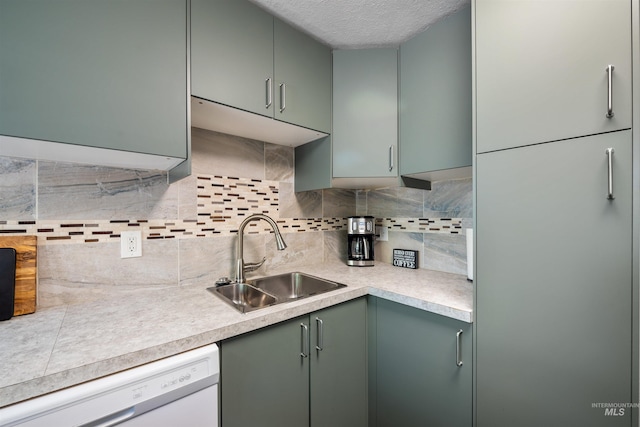 946 S Curtis Rd, Boise, ID 83705 - kitchen with a sink, dishwasher, backsplash, light countertops, and a textured ceiling