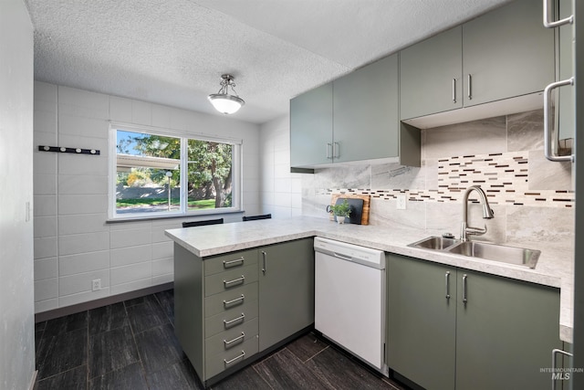 946 S Curtis Rd, Boise, ID 83705 - kitchen with dishwasher, a sink, a peninsula, gray cabinetry, and light countertops