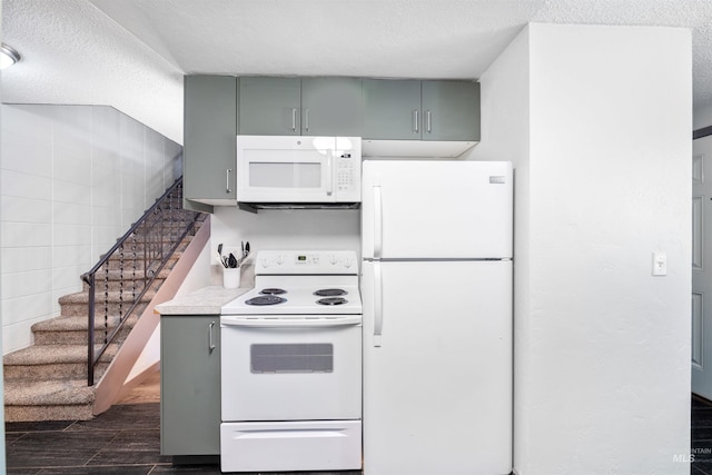 946 S Curtis Rd, Boise, ID 83705 - kitchen with white appliances, gray cabinets, dark wood-type flooring, and a textured ceiling