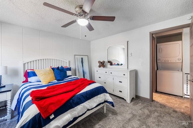 946 S Curtis Rd, Boise, ID 83705 - bedroom featuring estacked washer and dryer, light carpet, a textured ceiling, and ceiling fan