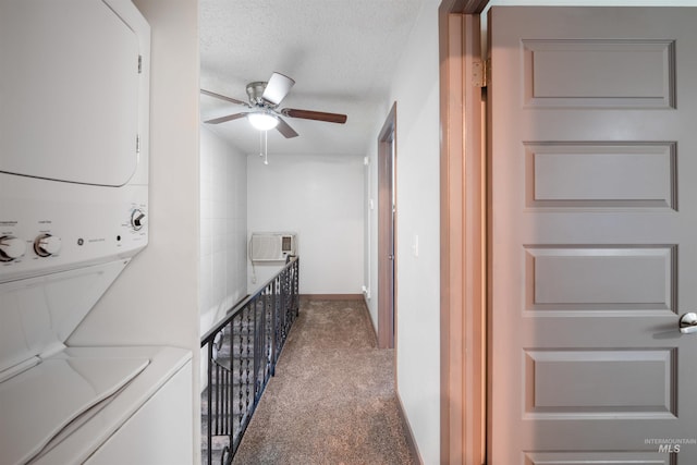 946 S Curtis Rd, Boise, ID 83705 - hallway with stacked washing machine and dryer, carpet floors, and a textured ceiling