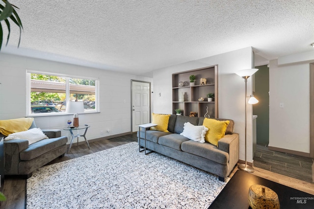 946 S Curtis Rd, Boise, ID 83705 - living room featuring wood finished floors, a textured ceiling, and baseboards