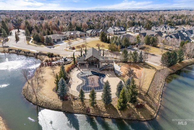 birds eye view of property featuring a water view