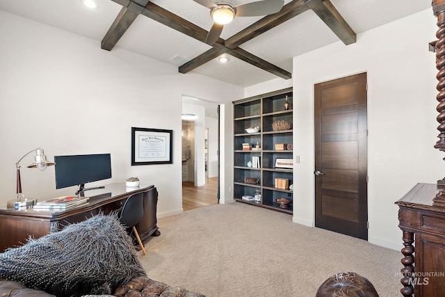 office area with light carpet and beam ceiling