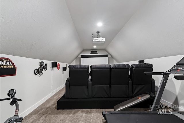 home theater featuring vaulted ceiling and carpet flooring