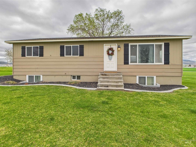 view of front of property featuring a front yard and entry steps
