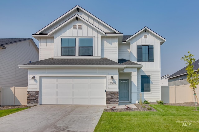 view of front facade with a garage and a front yard