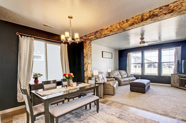 172 S Echo Canyon Ave, Meridian, ID 83642 - dining space with a chandelier, wood finished floors, visible vents, and baseboards