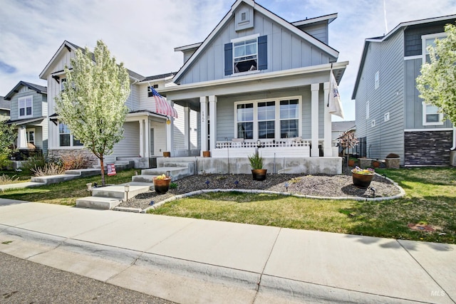 172 S Echo Canyon Ave, Meridian, ID 83642 - view of front of house featuring board and batten siding, a porch, and a front lawn