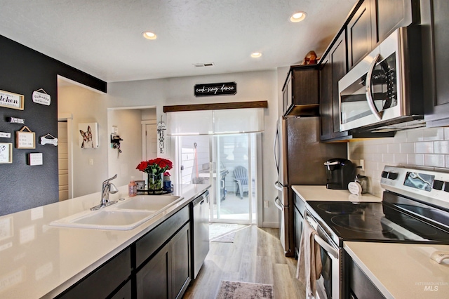 172 S Echo Canyon Ave, Meridian, ID 83642 - kitchen featuring visible vents, stainless steel appliances, light countertops, and a sink