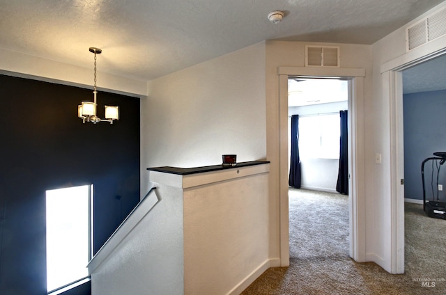 172 S Echo Canyon Ave, Meridian, ID 83642 - corridor featuring a chandelier, an upstairs landing, visible vents, and carpet