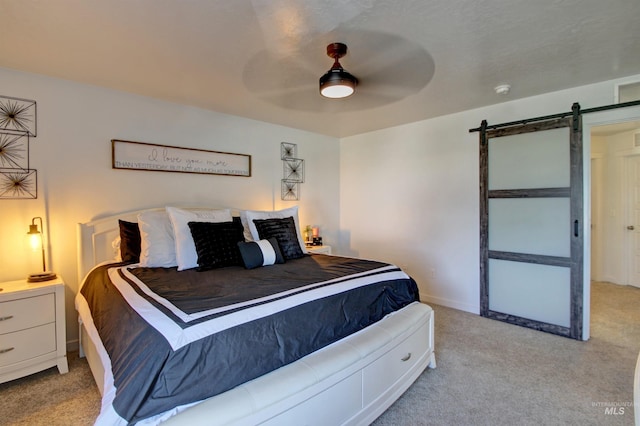 172 S Echo Canyon Ave, Meridian, ID 83642 - carpeted bedroom with a barn door, baseboards, and ceiling fan