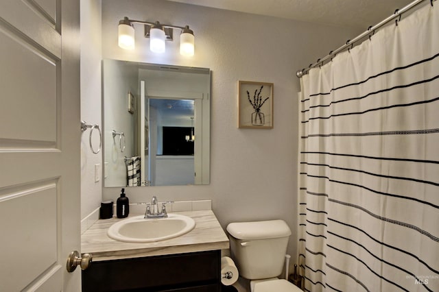 172 S Echo Canyon Ave, Meridian, ID 83642 - bathroom with toilet, vanity, and a shower with shower curtain