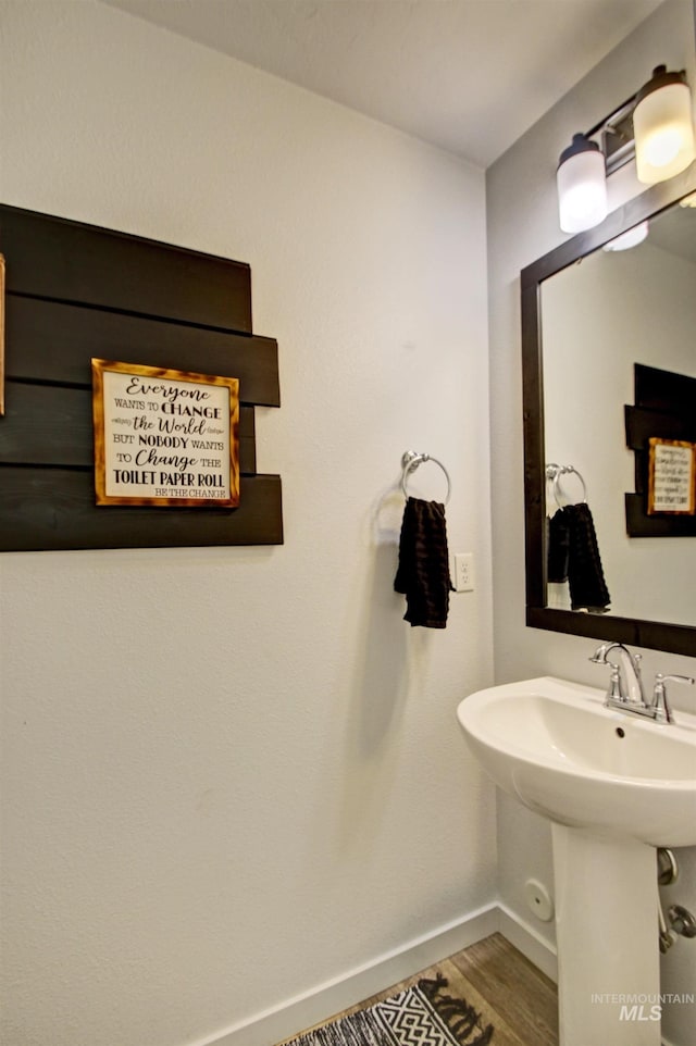 172 S Echo Canyon Ave, Meridian, ID 83642 - bathroom featuring wood finished floors, baseboards, and a sink