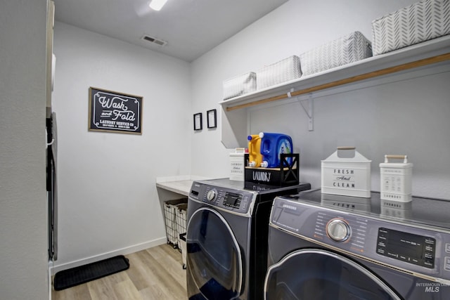 172 S Echo Canyon Ave, Meridian, ID 83642 - laundry area featuring light wood-style floors, baseboards, separate washer and dryer, and laundry area