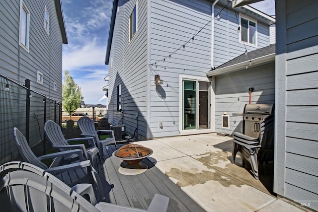 172 S Echo Canyon Ave, Meridian, ID 83642 - wooden deck featuring fence, a patio, and an outdoor fire pit