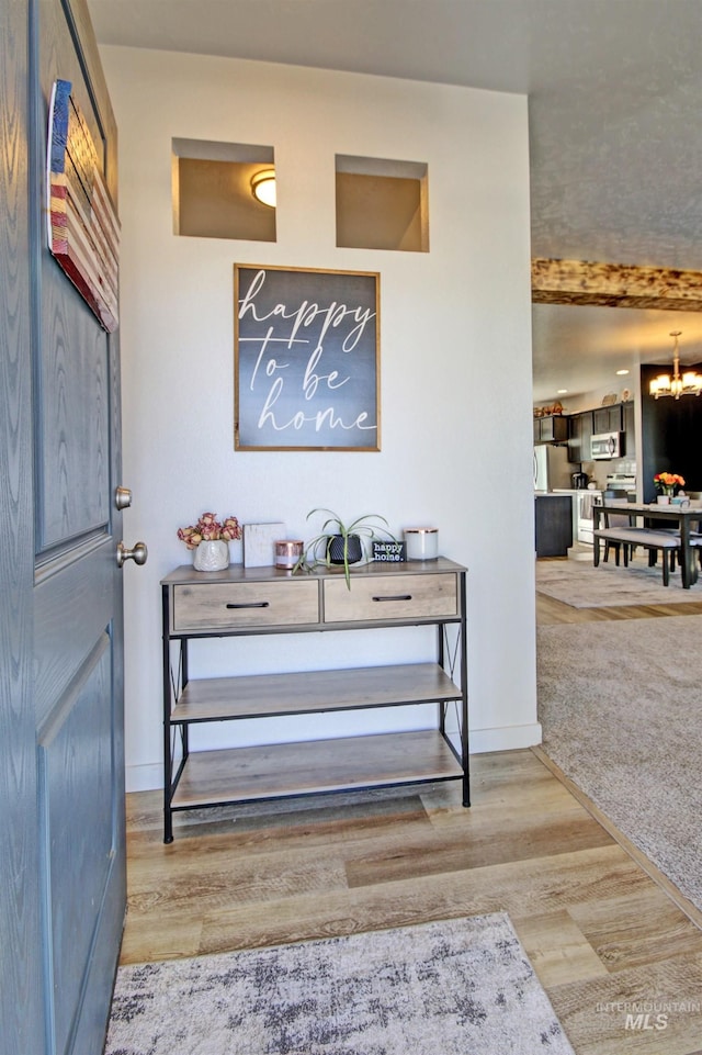 172 S Echo Canyon Ave, Meridian, ID 83642 - foyer entrance featuring a chandelier, wood finished floors, and baseboards