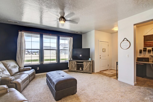 172 S Echo Canyon Ave, Meridian, ID 83642 - living room featuring light carpet, a ceiling fan, a textured ceiling, and baseboards