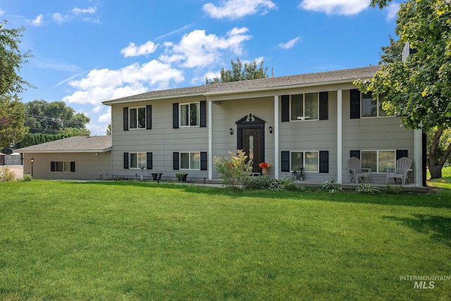 raised ranch with a front lawn