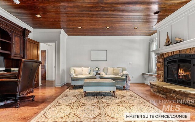 living room featuring crown molding, light hardwood / wood-style flooring, and wooden ceiling