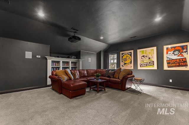 carpeted cinema room featuring lofted ceiling