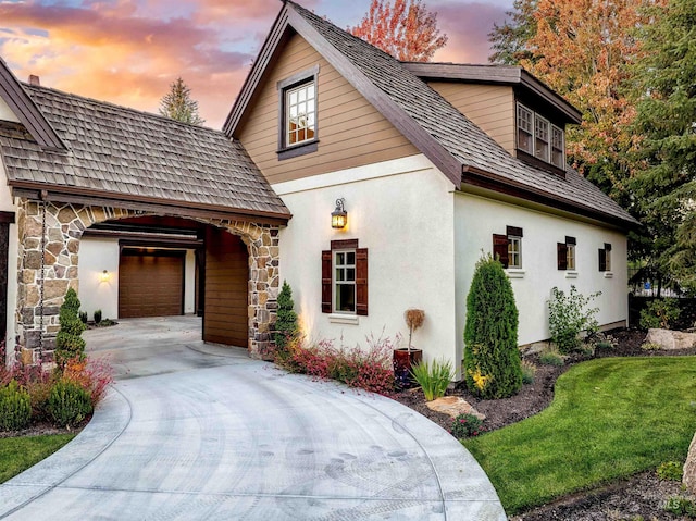 property exterior at dusk with a garage