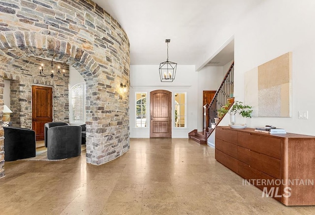 foyer featuring a chandelier