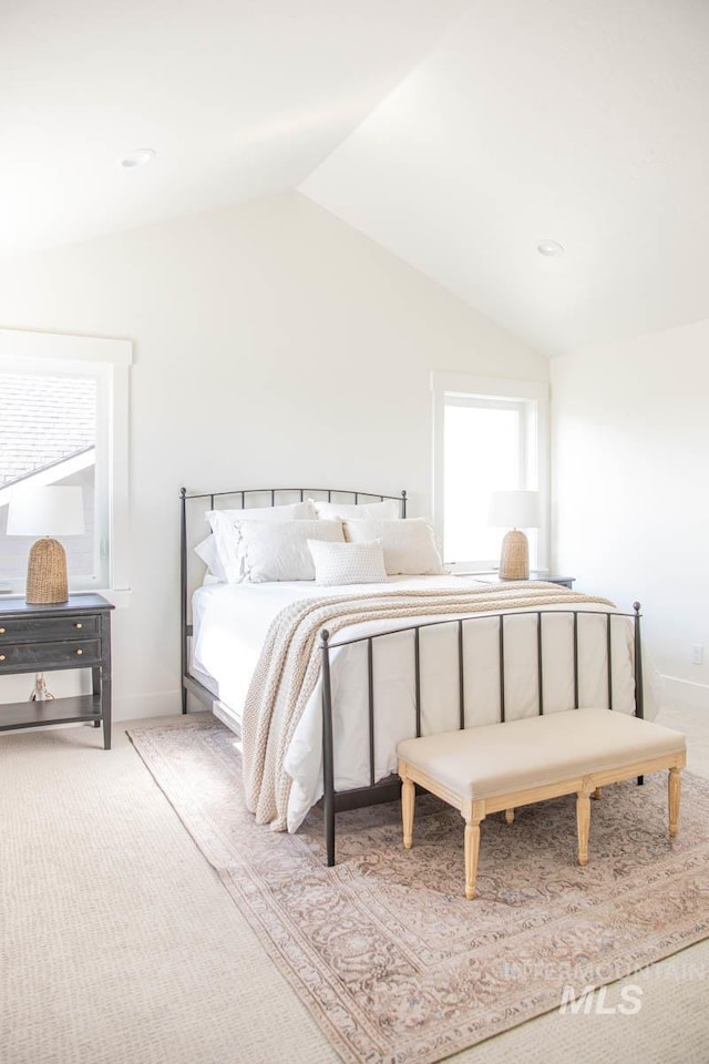 6104 S Apex Ave, Meridian, ID 83642 - carpeted bedroom featuring lofted ceiling and baseboards