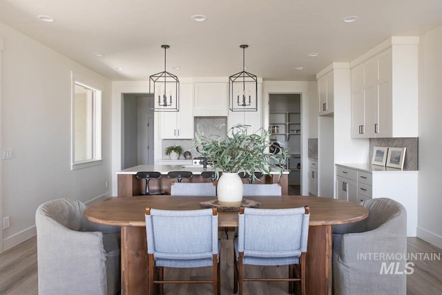 6104 S Apex Ave, Meridian, ID 83642 - dining space with wood finished floors and recessed lighting