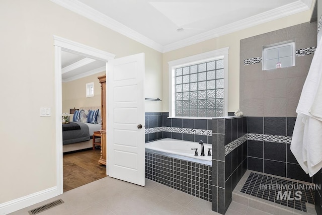 bathroom featuring tile patterned flooring, separate shower and tub, and crown molding