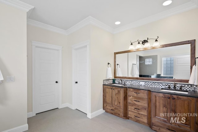 bathroom featuring crown molding, vanity, and tasteful backsplash