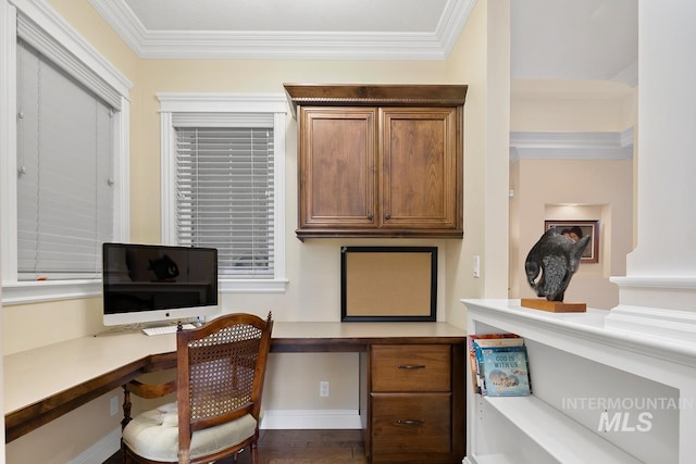 office area with built in desk, dark hardwood / wood-style floors, and crown molding