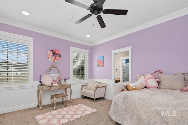 carpeted bedroom featuring crown molding, ceiling fan, and multiple windows