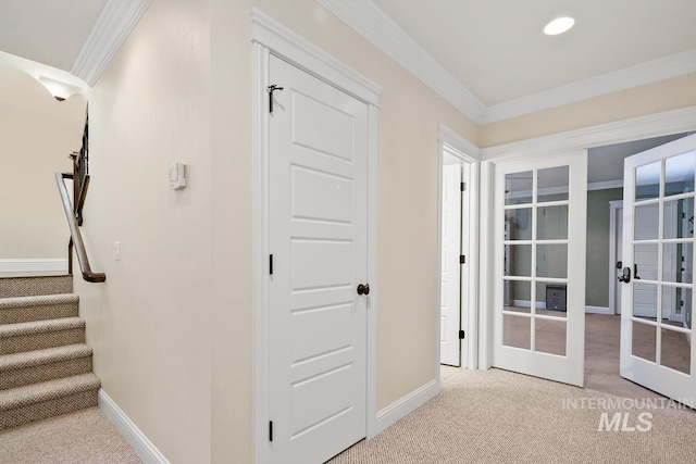 interior space with ornamental molding, light carpet, and french doors