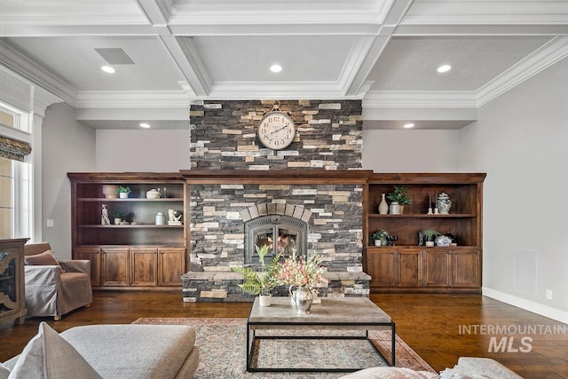 living room featuring beamed ceiling, dark hardwood / wood-style flooring, coffered ceiling, and a stone fireplace